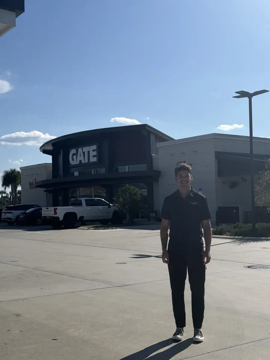 Kaden Ewald standing outside a GATE convenience store during his Florida visit.